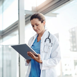 a doctor looks at a chart